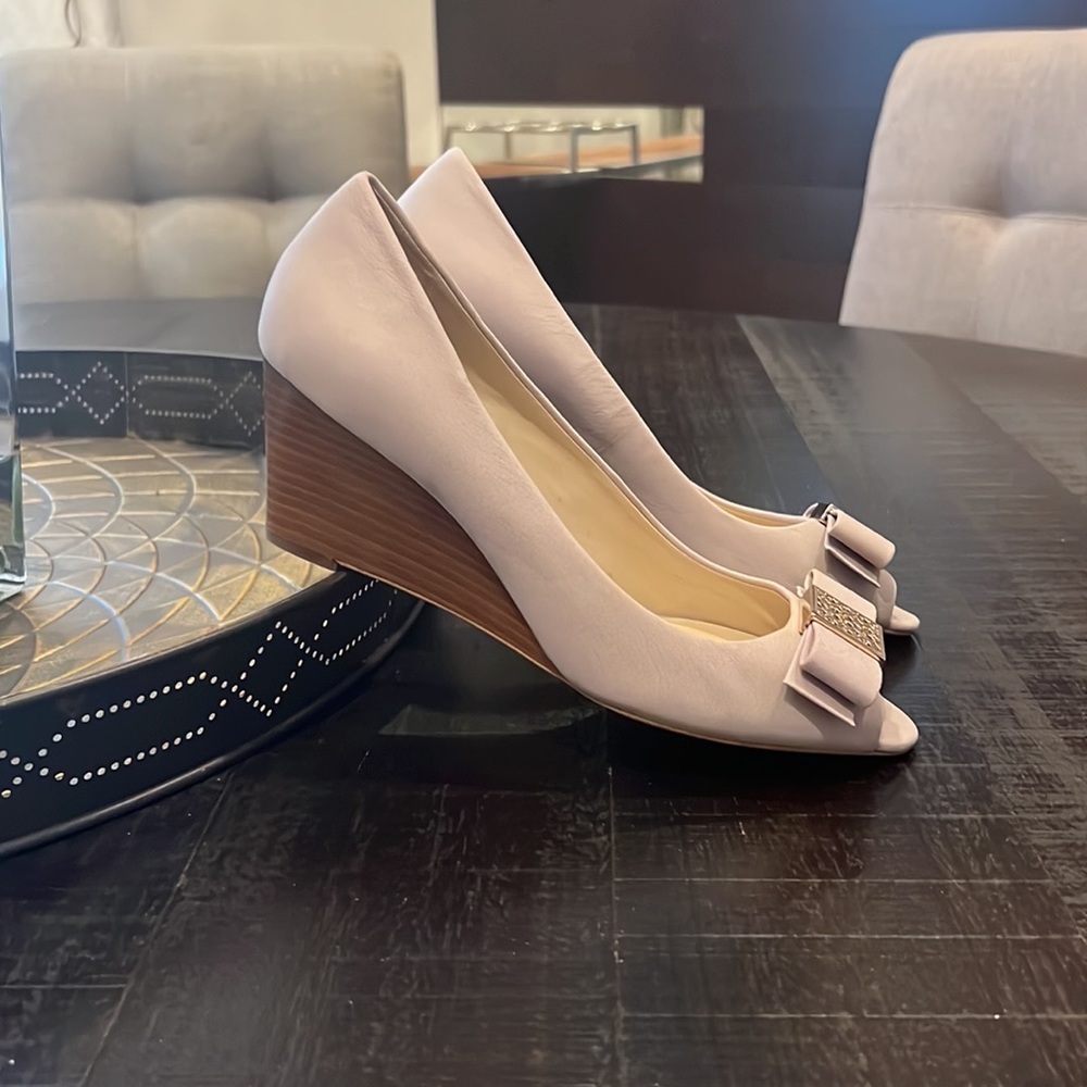 Brand new without tags, never worn. Coach “Gretchen” peep toe wedge pump.